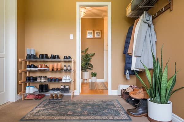 Efficient shoe rack for entryway clutter reduction and easy access.