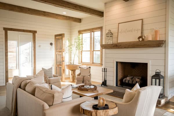 Bright farmhouse living room with rustic decor and comfortable seating.