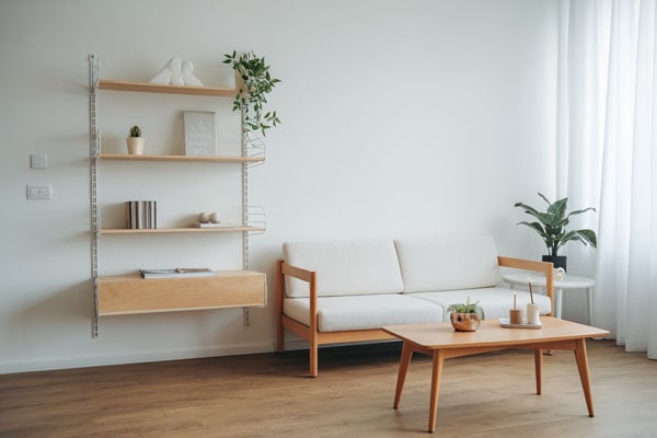 Bright and airy apartment living room with minimalist decor and natural light.
