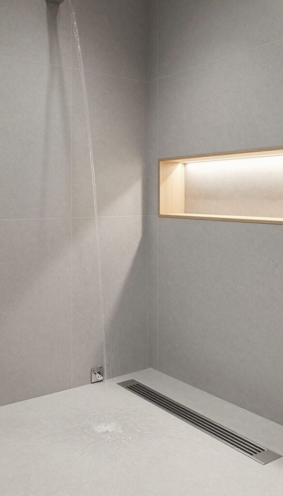 Modern bathroom shower with linear drain, large gray tiles, natural light, and minimalist decor for a polished conversion idea.