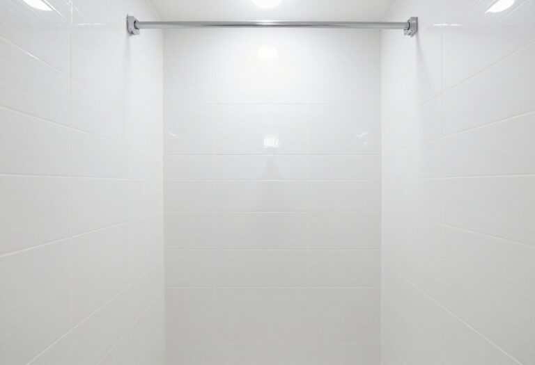 Clean white shower tile with bright grout lines