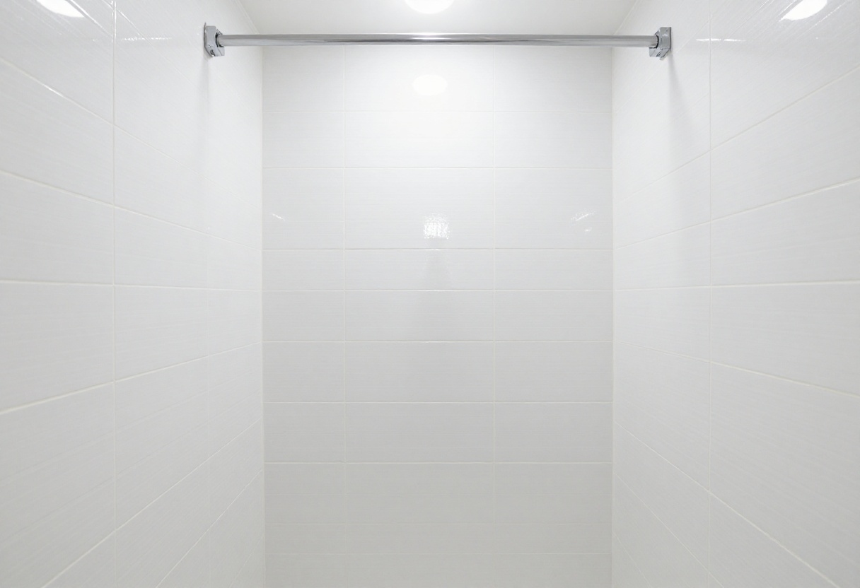 Clean white shower tile with bright grout lines
