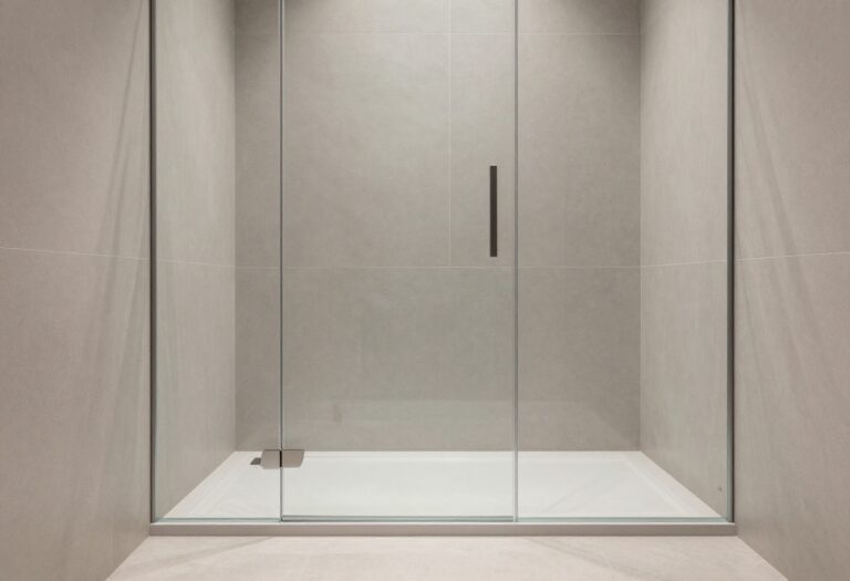 Modern bathroom with a low-profile shower tray and glass screen